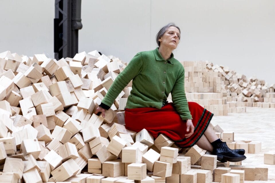 a woman sits on an&hellip;